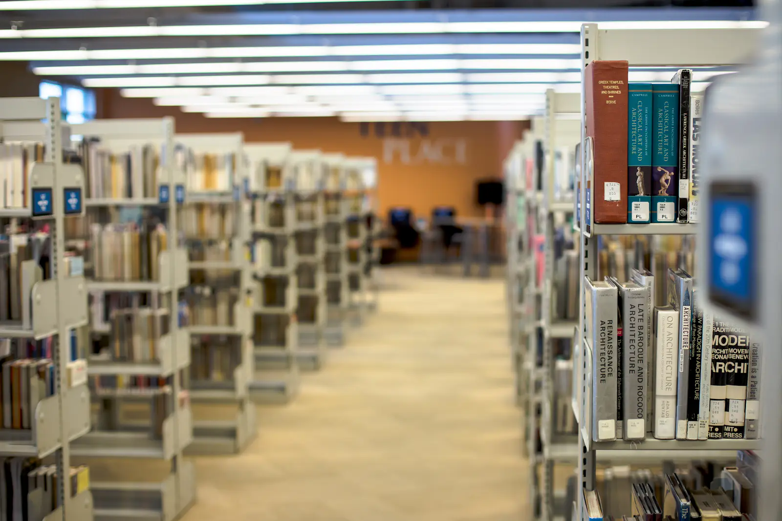 Rows of bookshelves inside a library.