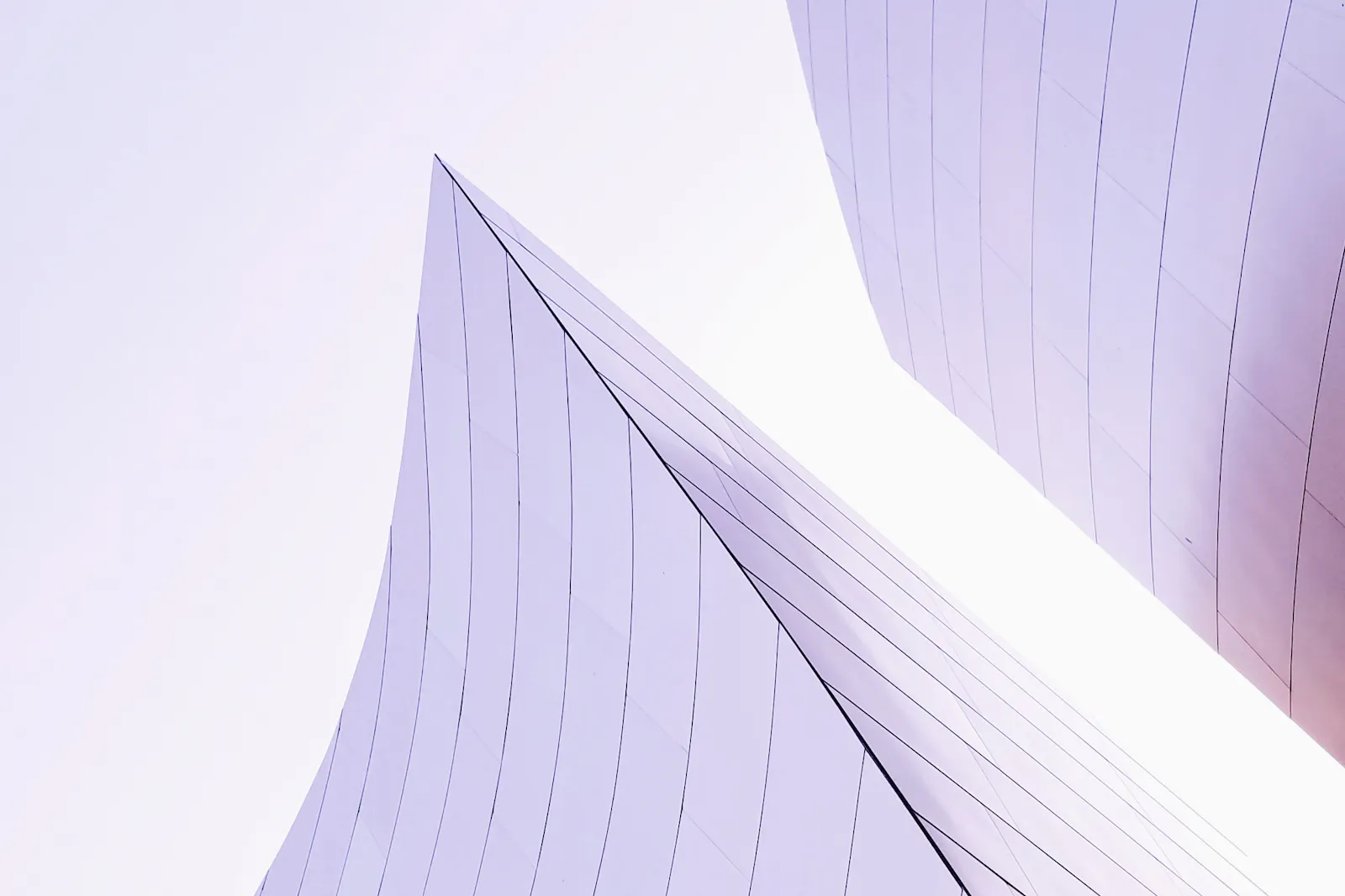 Pale architectural planes tapering towards the sky.